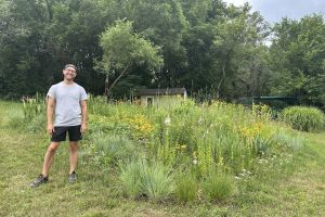 A man in yard with native plants