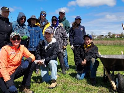 A group posing for the camera outdoors.