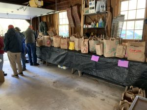 Bags of seed on a table. 
