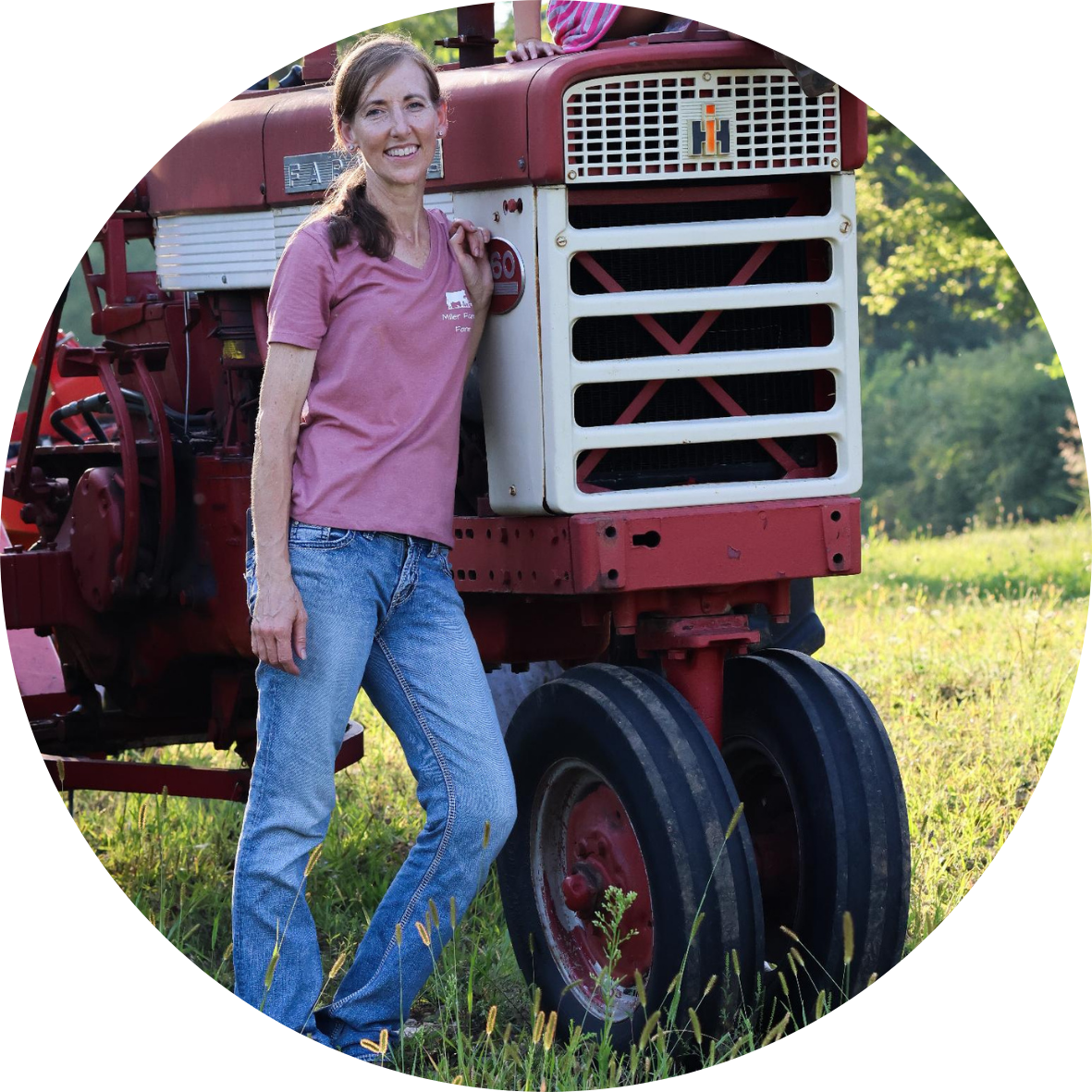 Michele Miller, farmer by a tractor. 