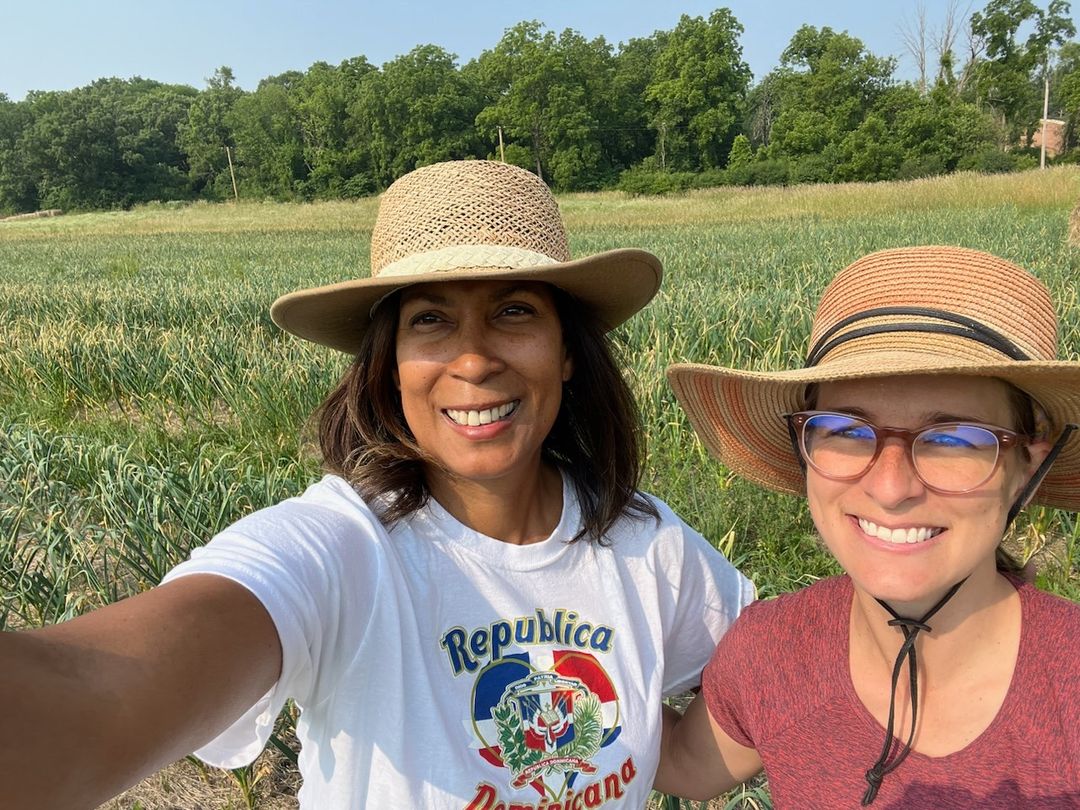 Two women in a farm field taking a selfie