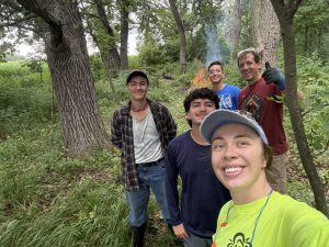 A group selfie in the woods. 