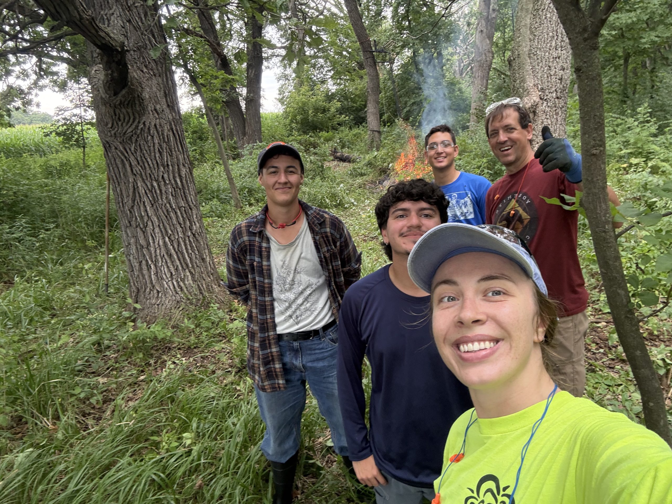 A group selfie in the woods.