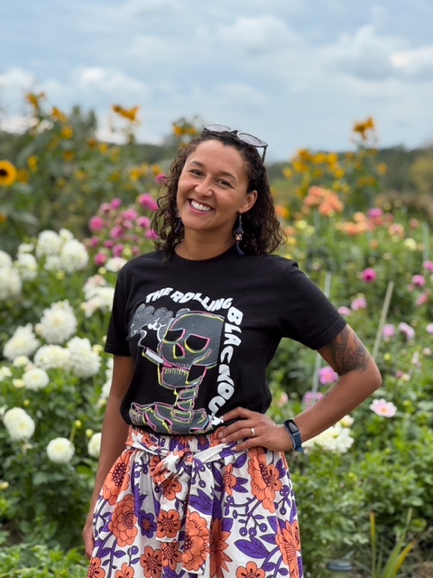 A woman farmer in a flower field 
