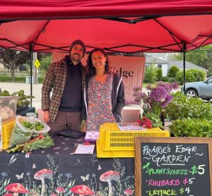 Emily and Derek Kessler at a farmer's market