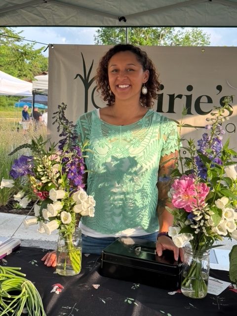 A woman working at a farmers market