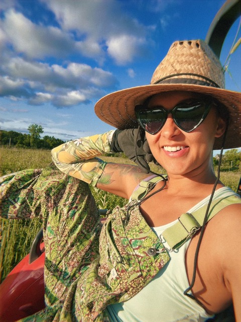 A woman farmer on a tractor